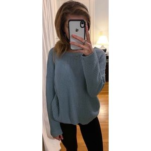 Blue sweater with opening in the back
